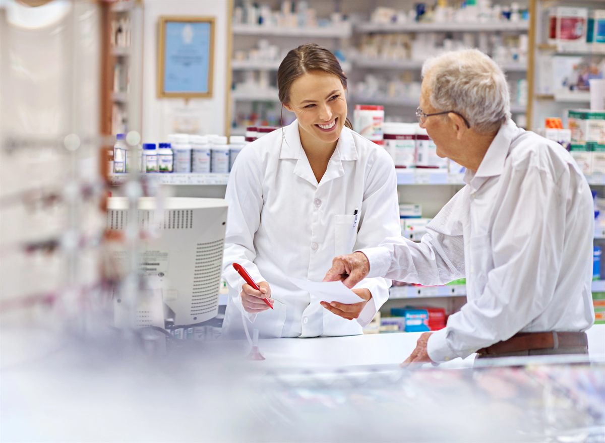 Randolph Drug Store pharmacist assisting a customer